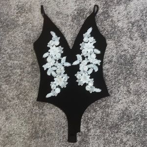 Black Low V Bodysuit With White Floral Embroidery